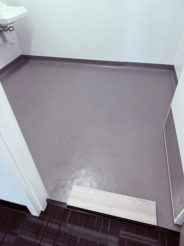 Installed commercial sheet vinyl with coved base in Charlotte