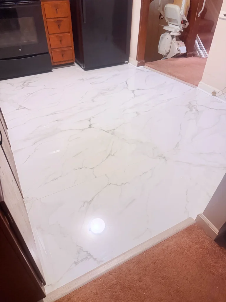 Installed marble-look porcelain tile flooring in Monroe